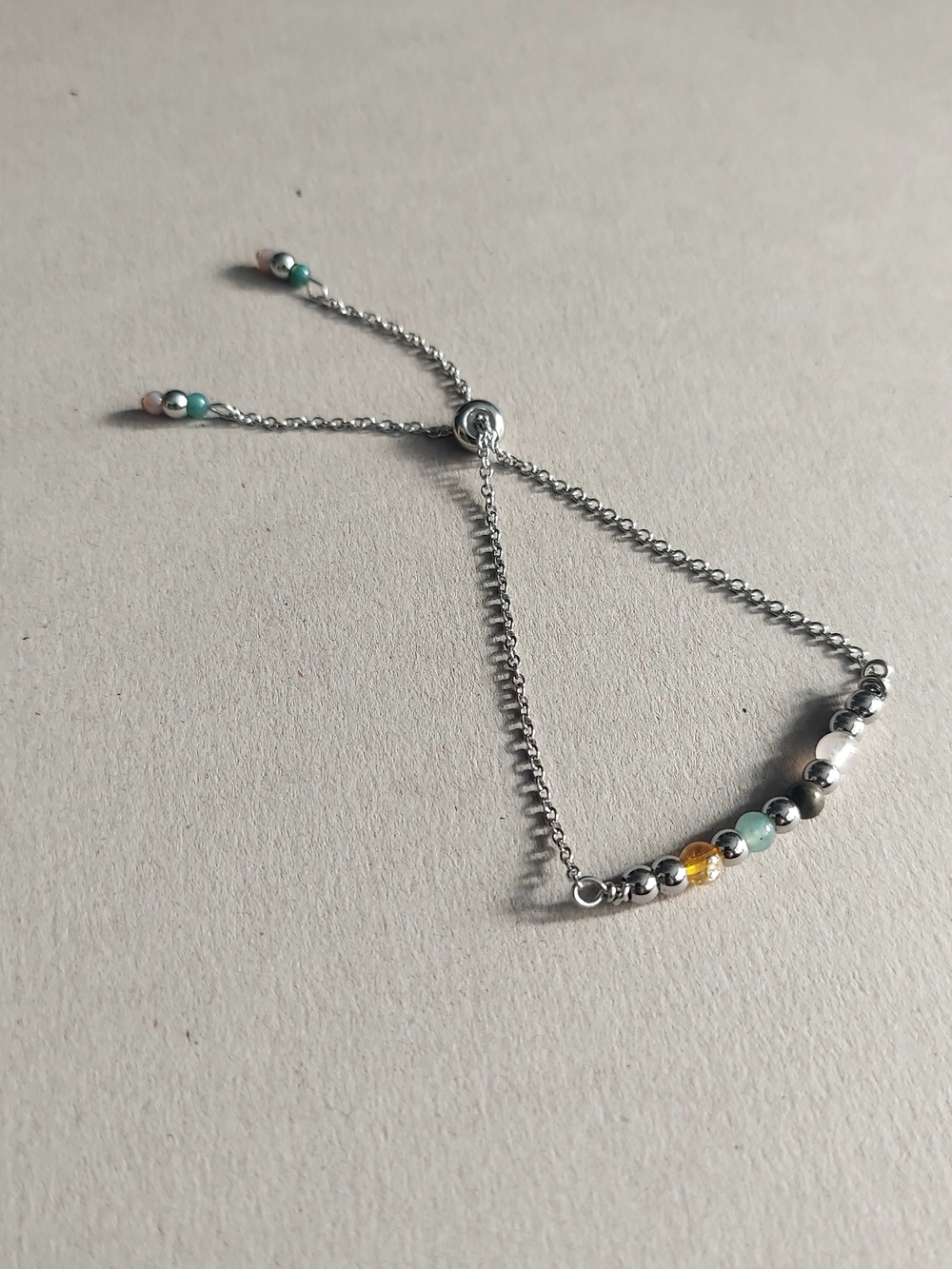 Bracelet for abundance in stainless steel and semi-precious stones.